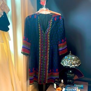 Incredible dress. Unique. Sheer in the arms and beaded. Light and easy to wear.